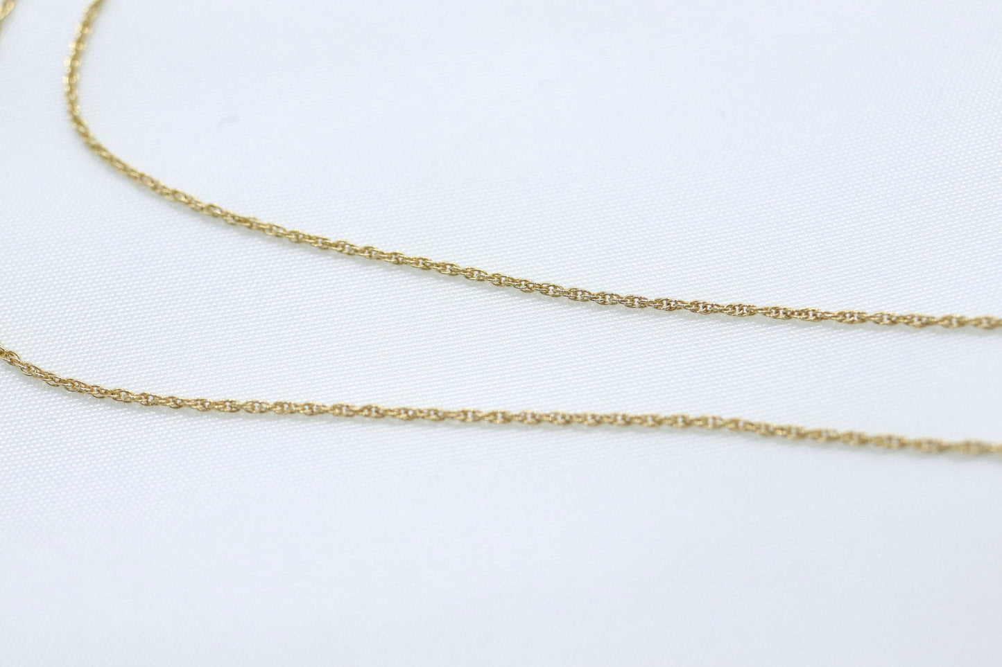 14k Diamond cross. 14k Yellow gold crucifix with twisted rope necklace chain