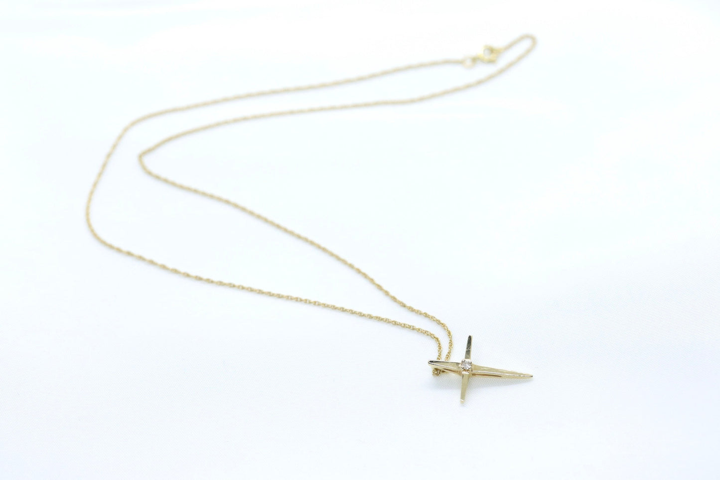 14k Diamond cross. 14k Yellow gold crucifix with twisted rope necklace chain