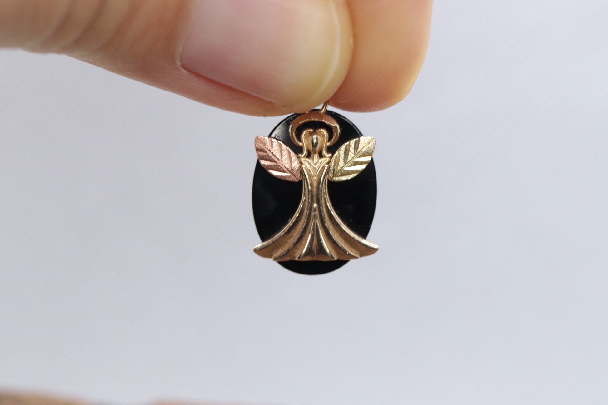Black Hills Gold Angel Onyx Pendant. 10k multi tone Black Hills Gold Guardian Angel Pendant (58/65)