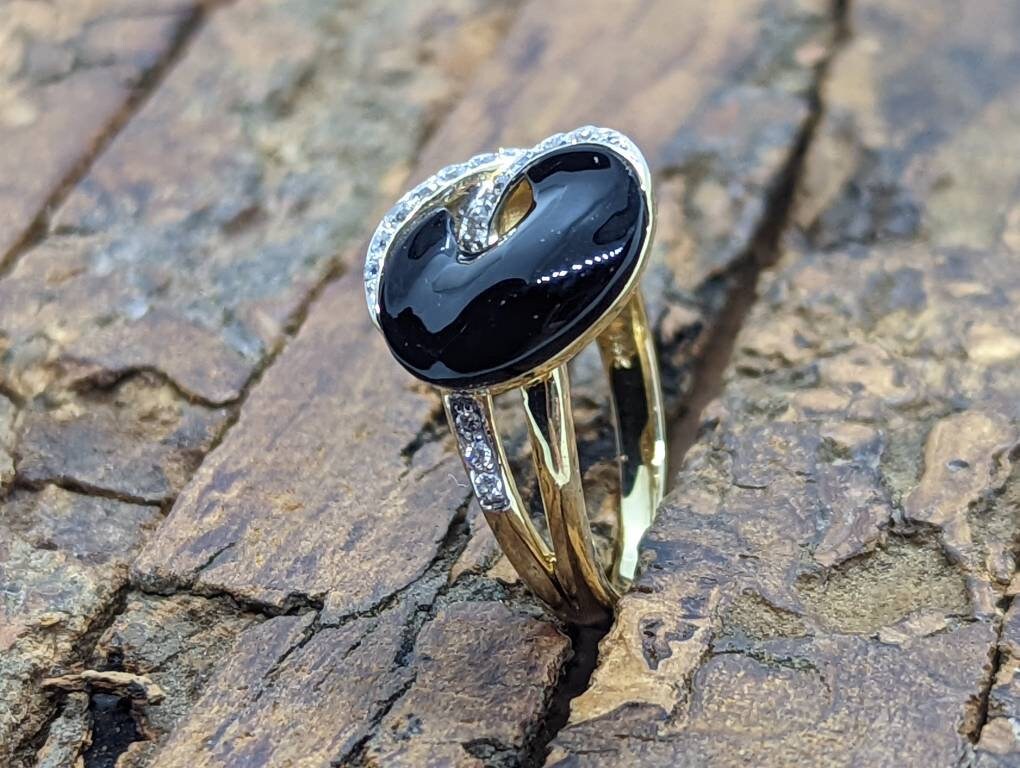 14k Onyx and diamond Band. 14k Curved Oval Disk Onyx and channel set diamond ring. Abstract Onyx ring. st (138/00)