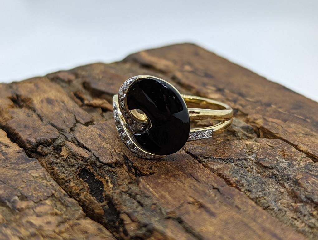 14k Onyx and diamond Band. 14k Curved Oval Disk Onyx and channel set diamond ring. Abstract Onyx ring. st (138/00)