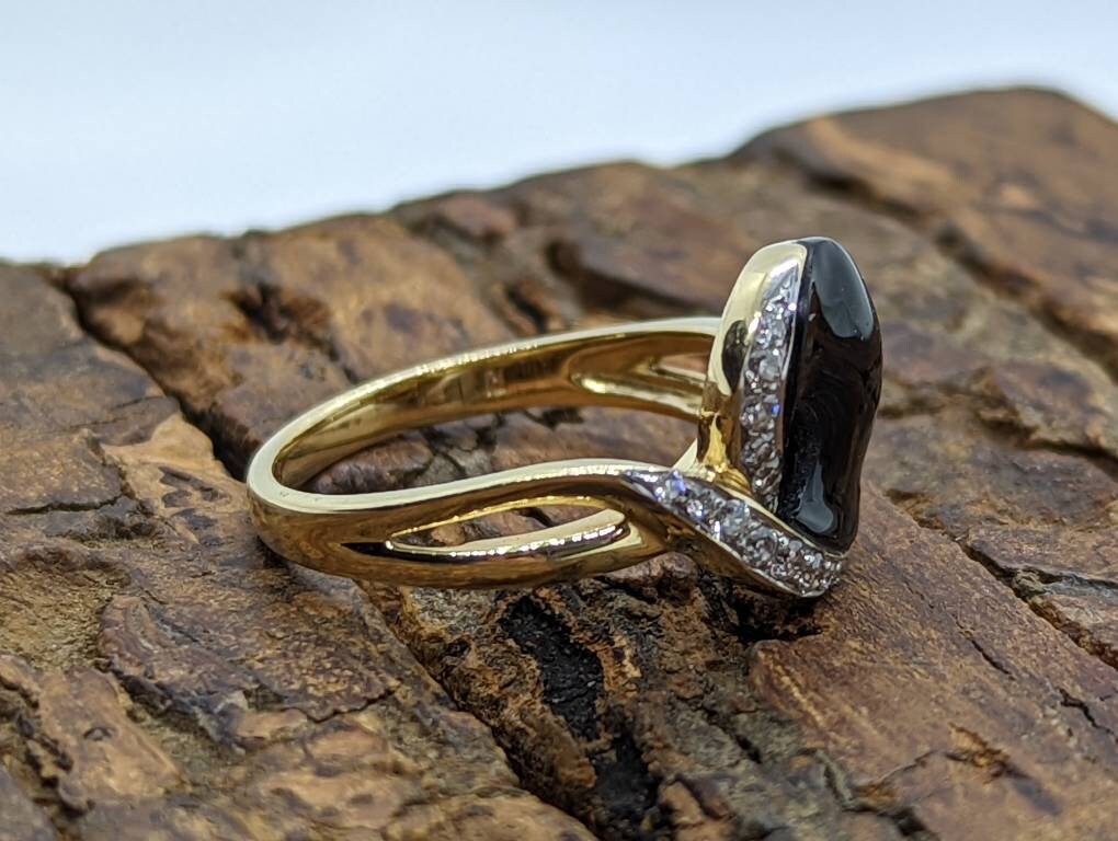 14k Onyx and diamond Band. 14k Curved Oval Disk Onyx and channel set diamond ring. Abstract Onyx ring. st (138/00)