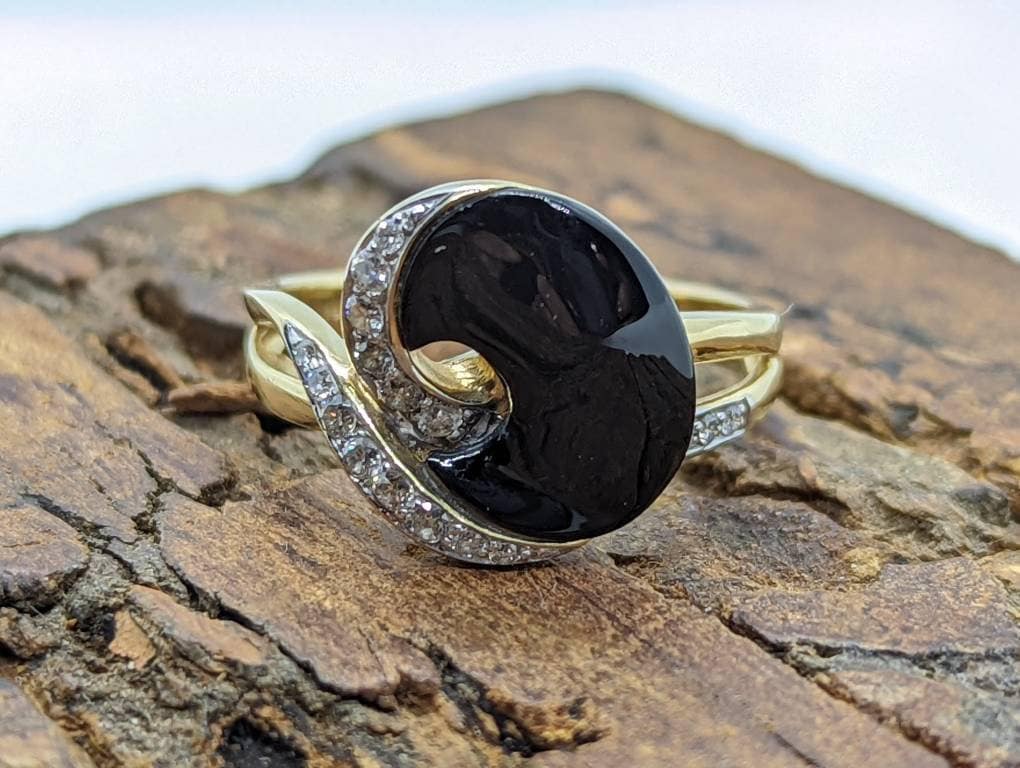 14k Onyx and diamond Band. 14k Curved Oval Disk Onyx and channel set diamond ring. Abstract Onyx ring. st (138/00)