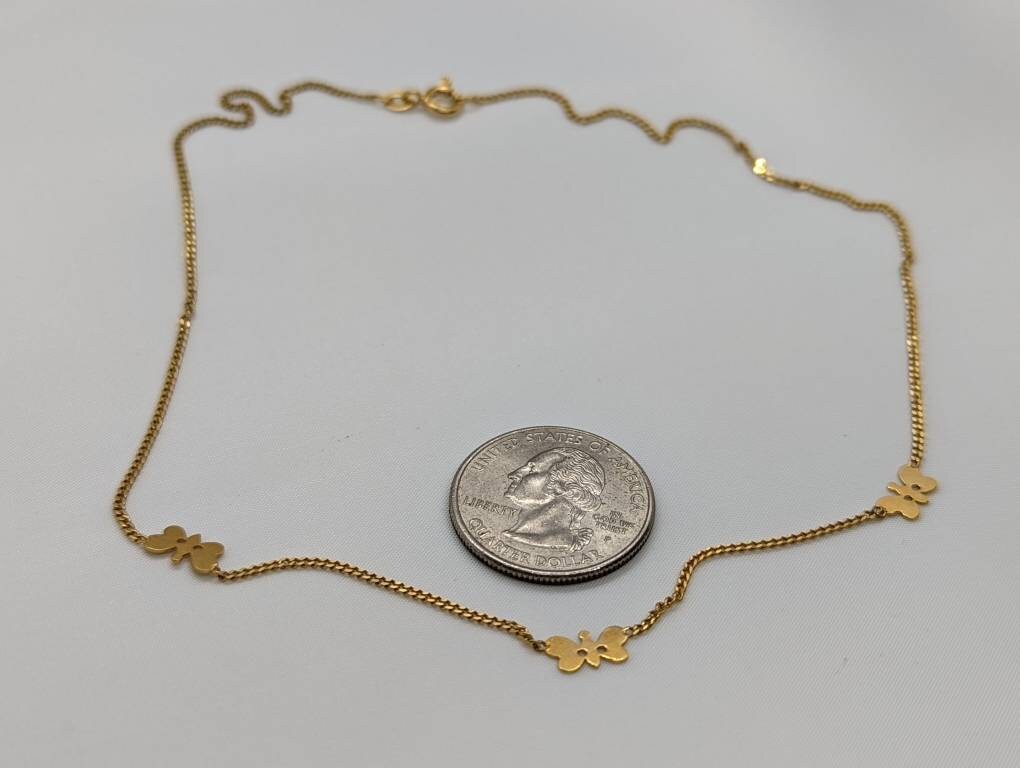 14k Butterfly Necklace. Multiple Butterfly pendants on a necklace. Yellow gold curb chain. st77/60