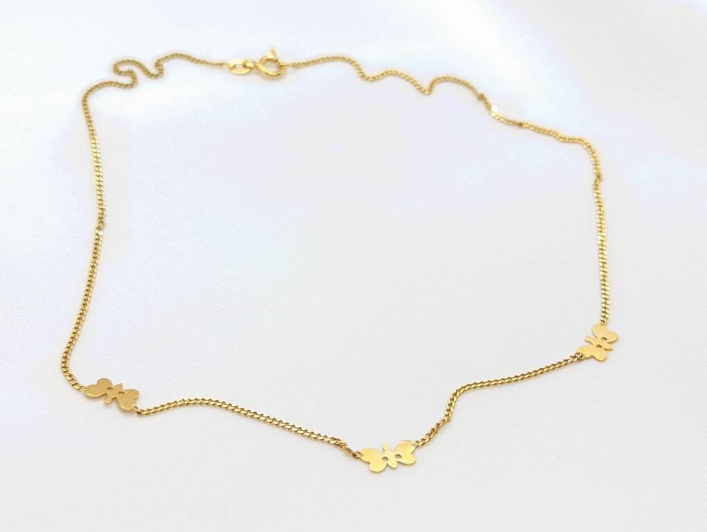 14k Butterfly Necklace. Multiple Butterfly pendants on a necklace. Yellow gold curb chain. st77/60