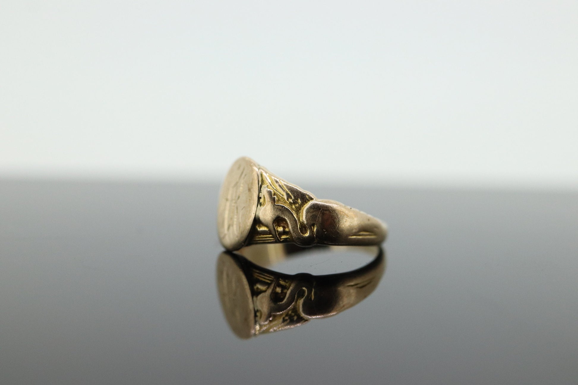 Signet Ring. 10k Yellow gold with STORK Bird Embossed shoulders. engraved HK can be engraved. st(37)
