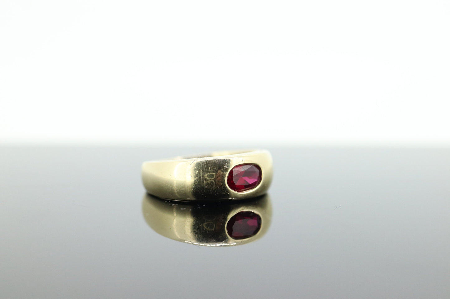 14k Ruby Ring. Bezel set Ruby ring. 14k yellow gold and oval Ruby bezel set. Wide ruby band. st(106)