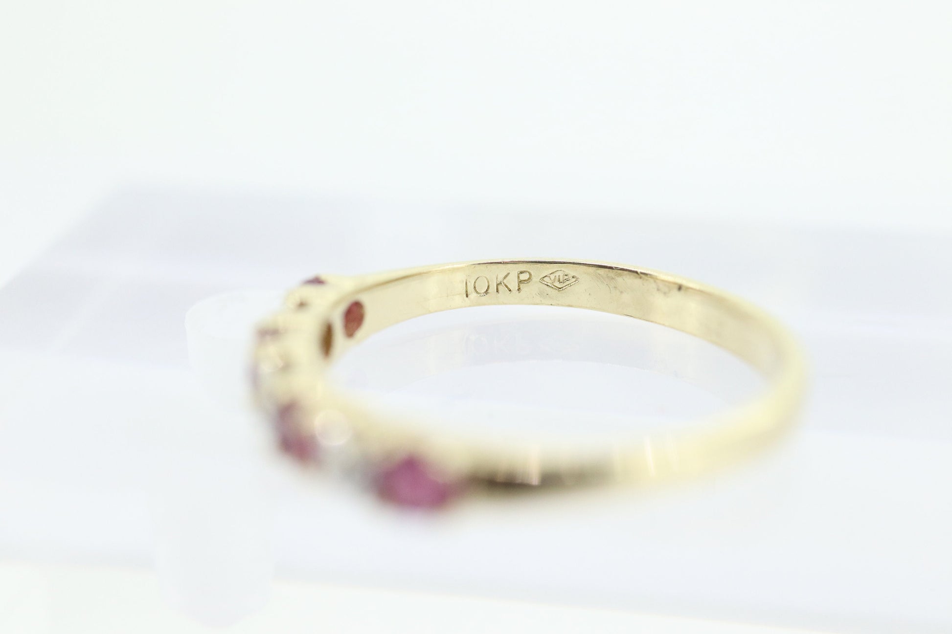 10k Anniversary Ruby Ring. A 10k gold ring with round Ruby and diamond accents eternity band. st(72)