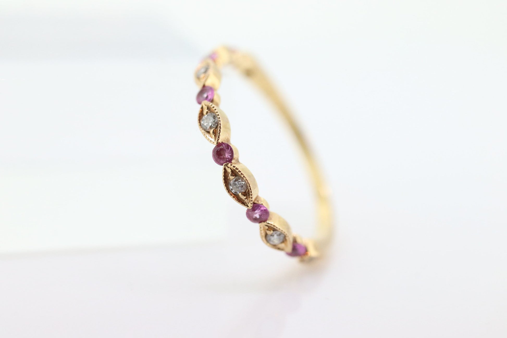 DAUSSI 18k Anniversary Ruby Diamond Ring. Henri Daussi 18k gold ring with round Ruby and diamond accents eternity band. st(253)