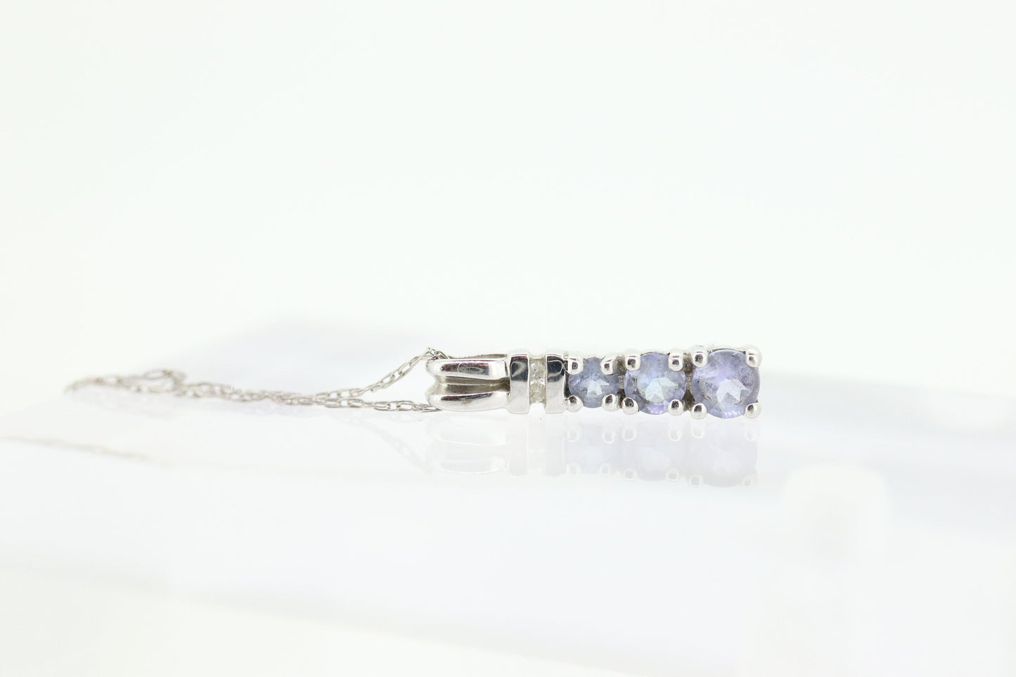 10k Tanzanite and diamond Journey Pendant. Past present future necklace