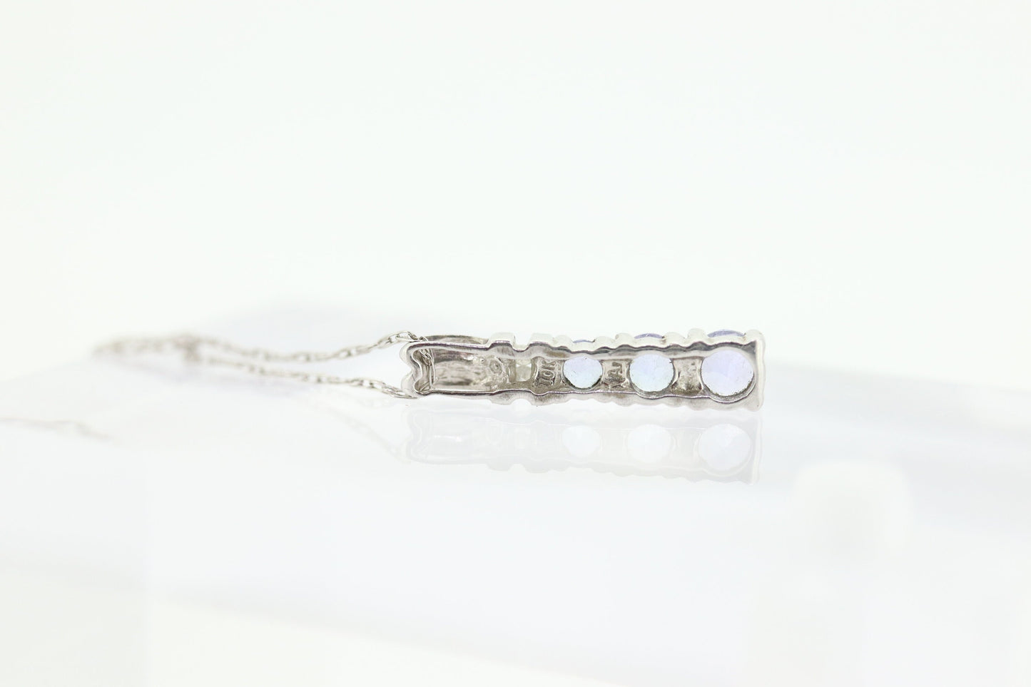 10k Tanzanite and diamond Journey Pendant. Past present future necklace