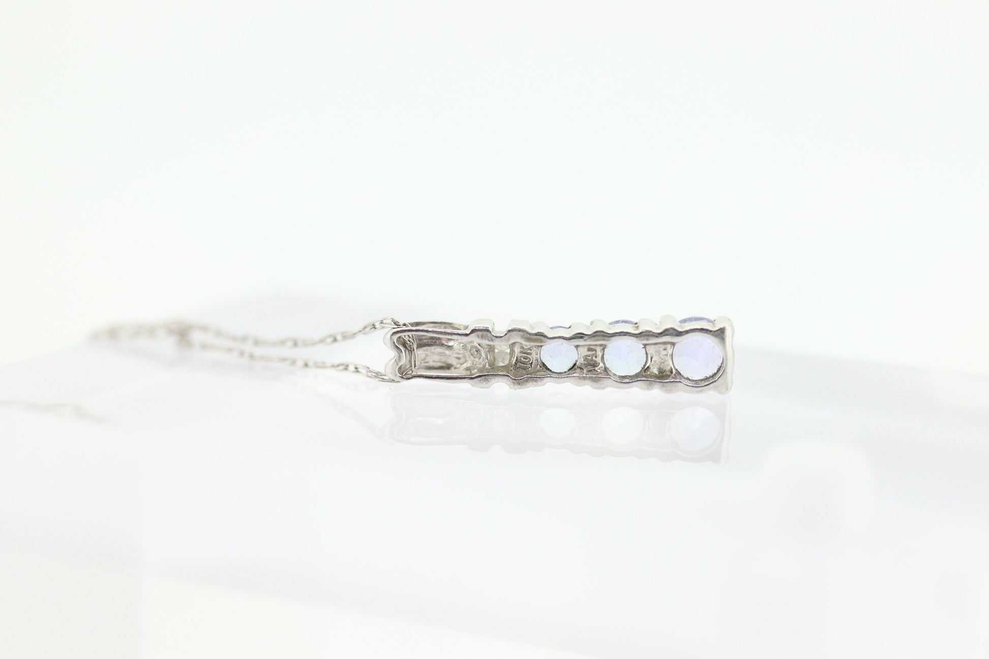 10k Tanzanite and diamond Journey Pendant. Past present future necklace