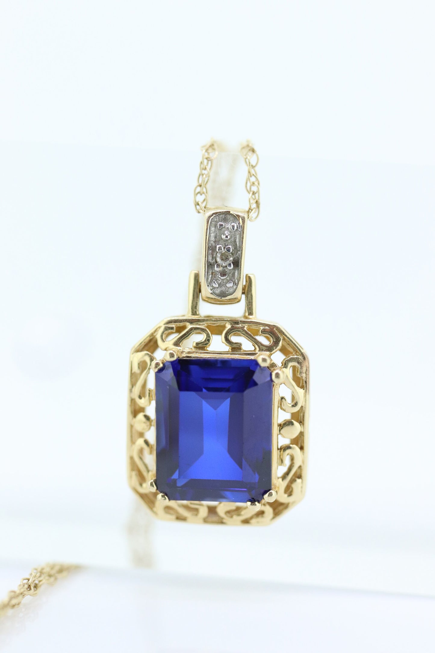 Blue emerald Sapphire and diamond 10k pendant. 10k twisted rope necklace