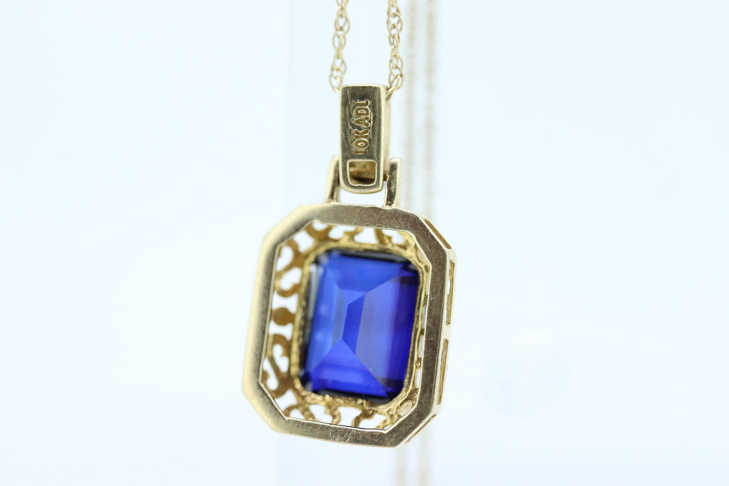 Blue emerald Sapphire and diamond 10k pendant. 10k twisted rope necklace