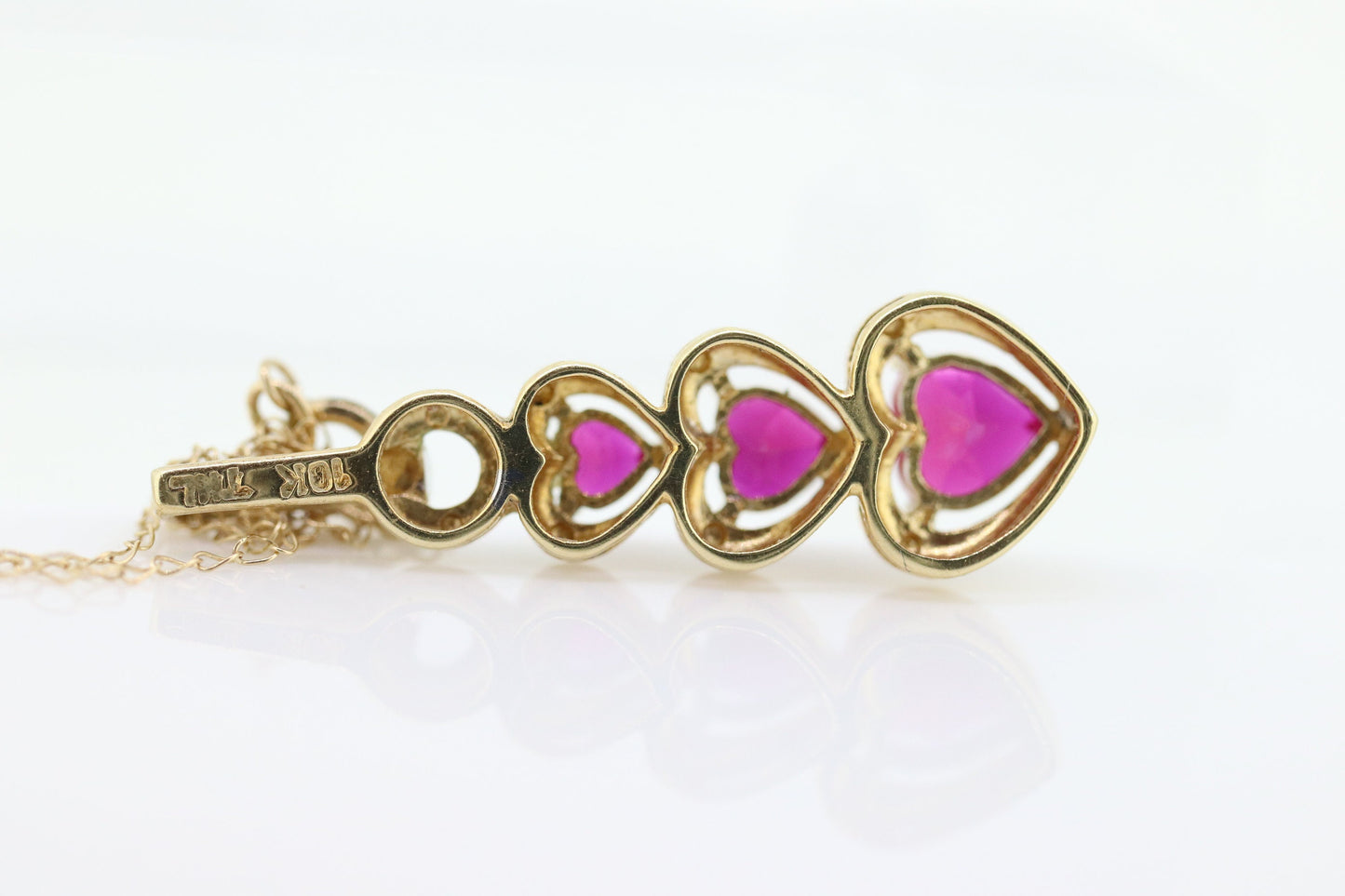 10k Ruby Faceted Heart with Diamond Necklace. 10k THL chain necklace and Pendant. st(78)
