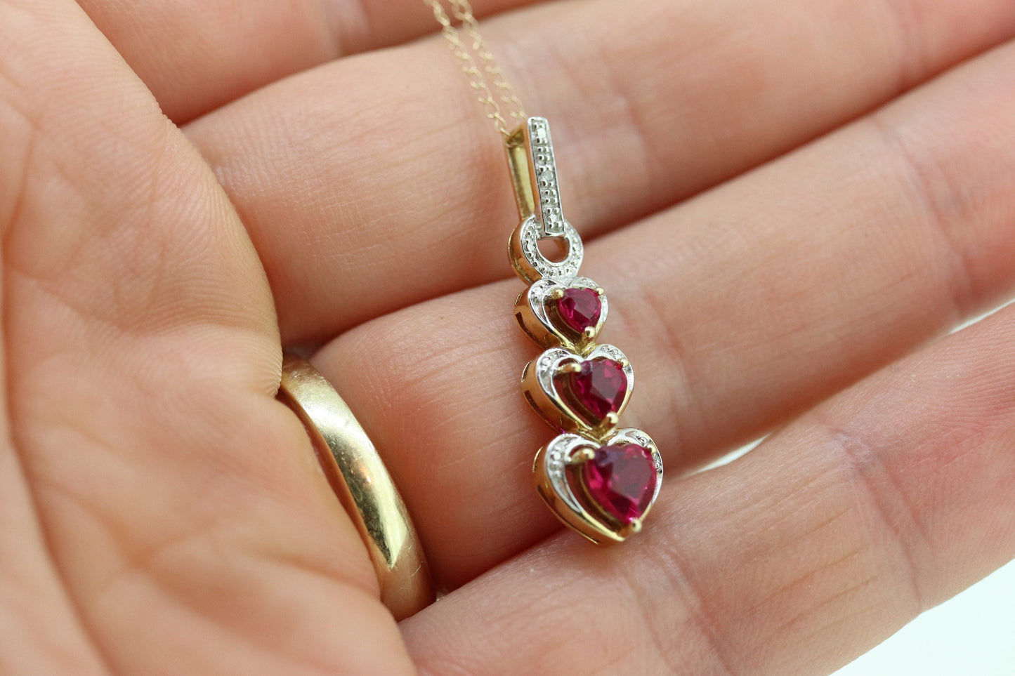 10k Ruby Faceted Heart with Diamond Necklace. 10k THL chain necklace and Pendant. st(78)