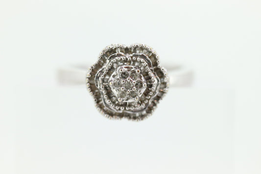 Diamond Daisy Cluster Elevated Ring. 10k White gold with round baguette diamond flower arrangement. st(52/90)