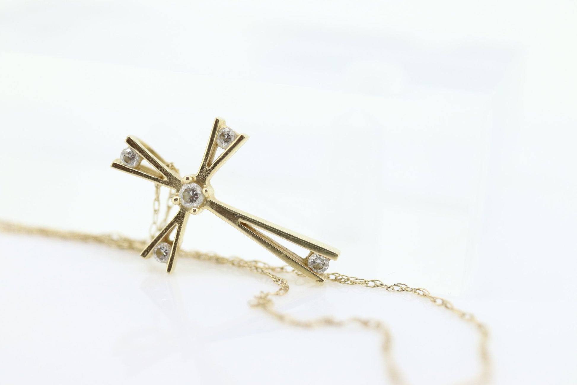 10k cross with diamonds pendant and rope chain necklace. Diamond tension Cross. 10k Yellow Gold.