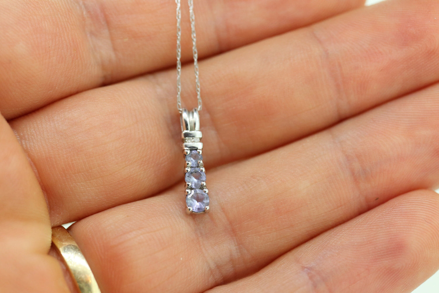 10k Tanzanite and diamond Journey Pendant. Past present future necklace
