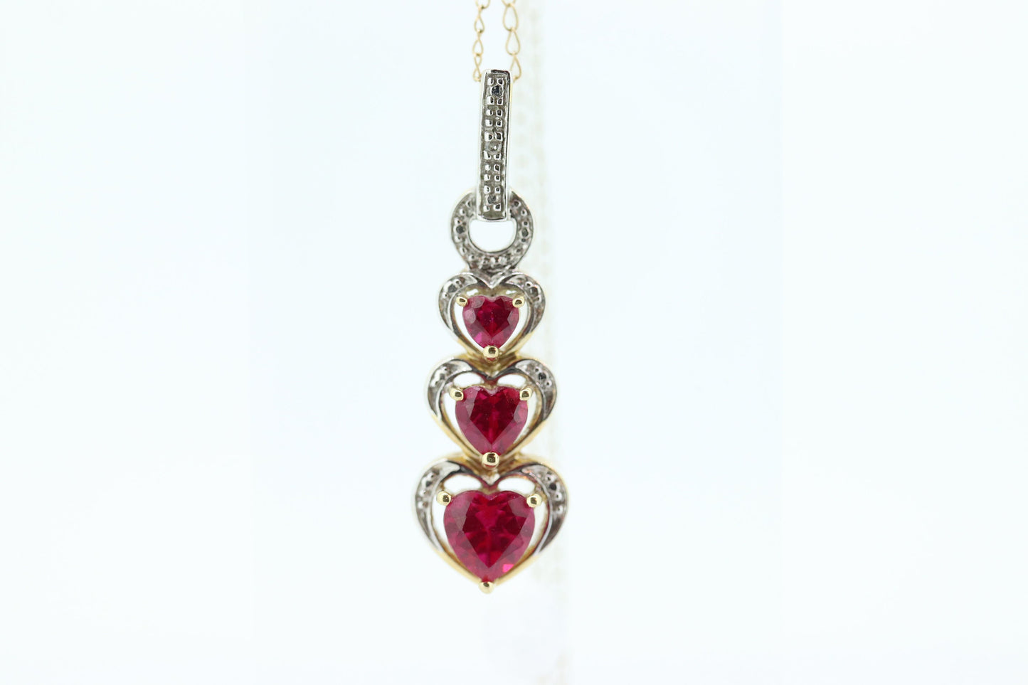 10k Ruby Faceted Heart with Diamond Necklace. 10k THL chain necklace and Pendant. st(78)