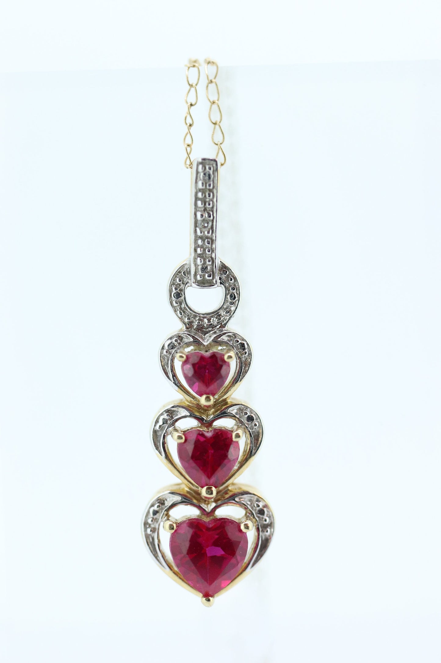 10k Ruby Faceted Heart with Diamond Necklace. 10k THL chain necklace and Pendant. st(78)