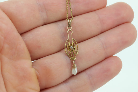 Otsby Barton Diamond pendant lavaliere. 10k Gold with a diamond set buttercup with rice pearl pendant for necklace. Otsby Barton (st80)