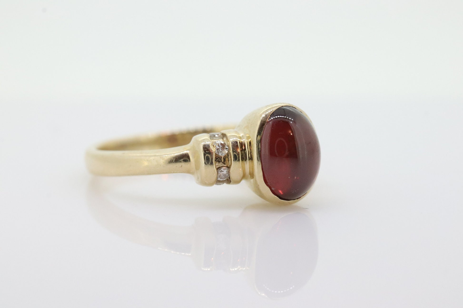 10k Red Tourmaline Ring. Bezel set OVAL Cabochon Tourmaline solitaire and diamond ring. st(92)