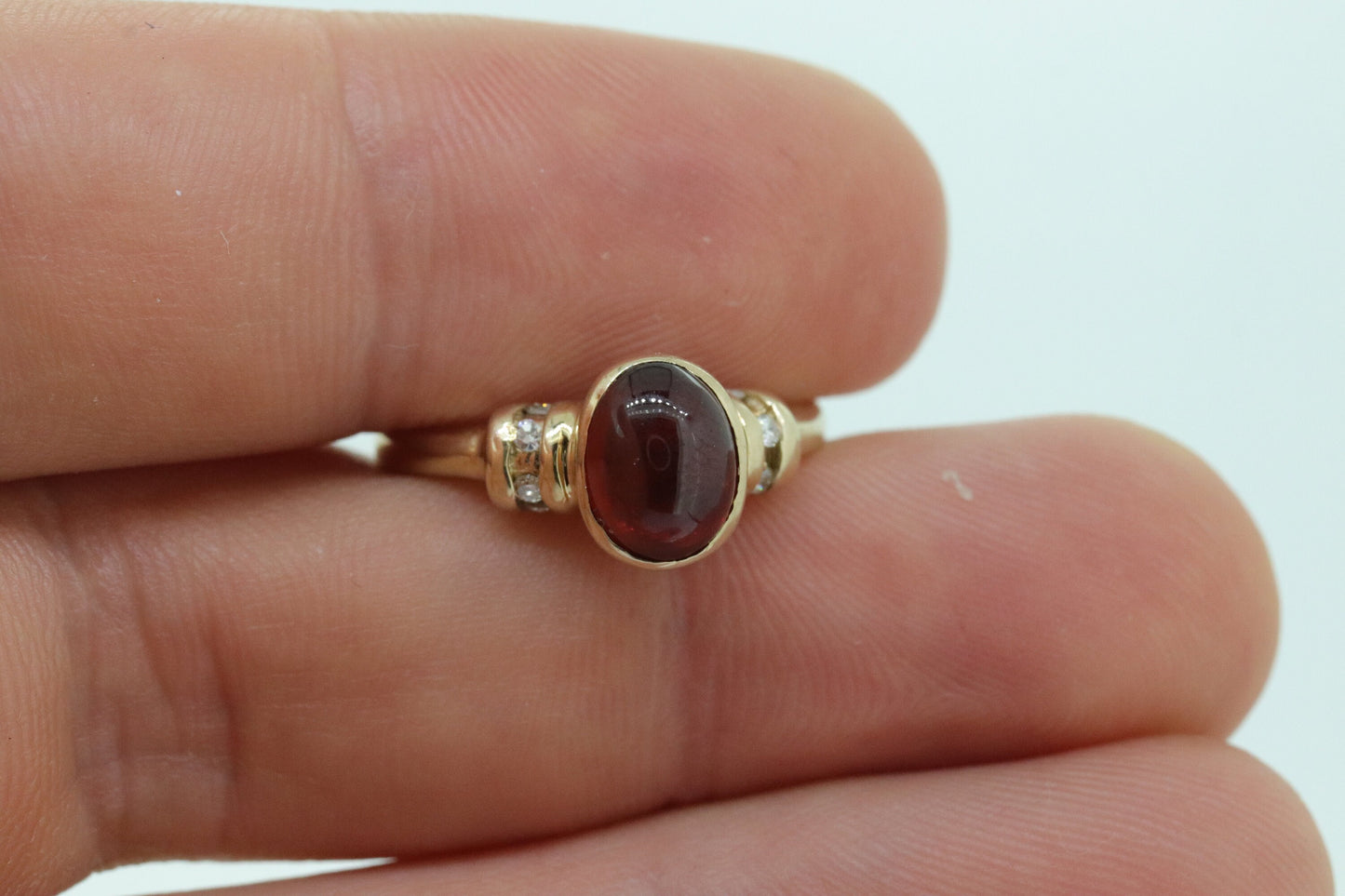 10k Red Tourmaline Ring. Bezel set OVAL Cabochon Tourmaline solitaire and diamond ring. st(92)