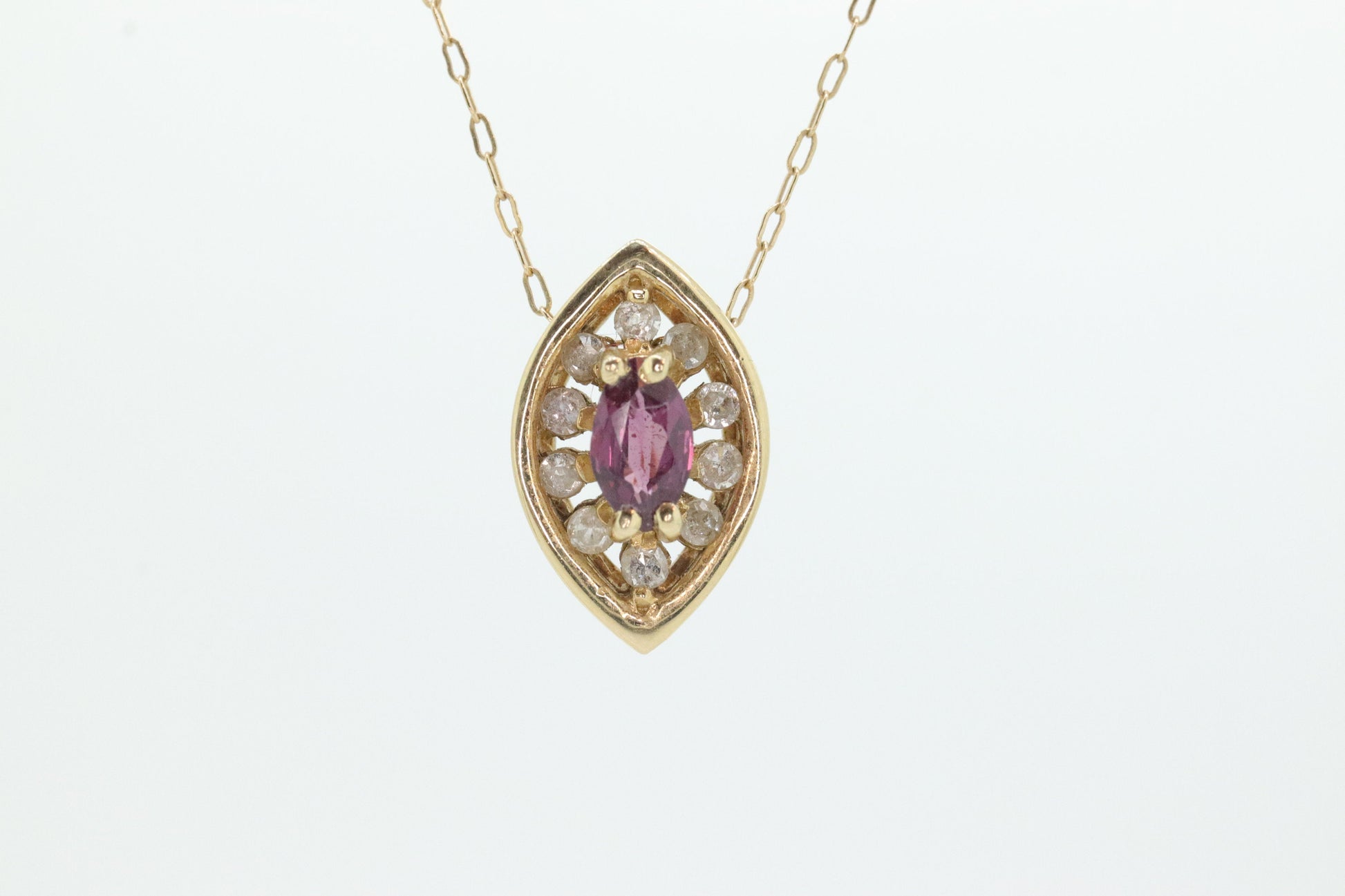 Ruby and diamond halo pendant. 14k precious marquise ruby pendant necklace. st(80/50)