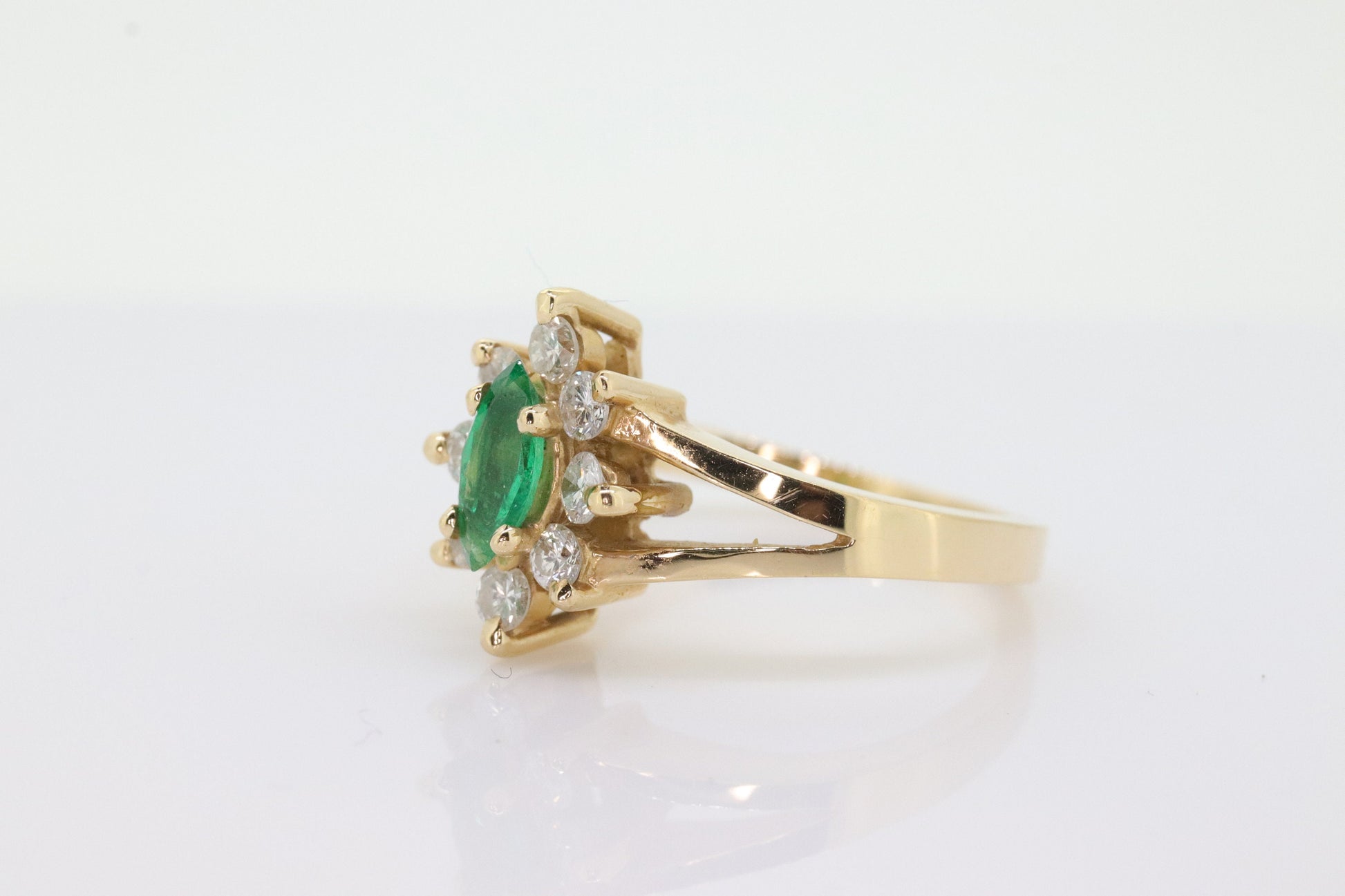 14k Marquise Emerald and Diamond Halo yellow gold ring. 0.36ctw in diamonds