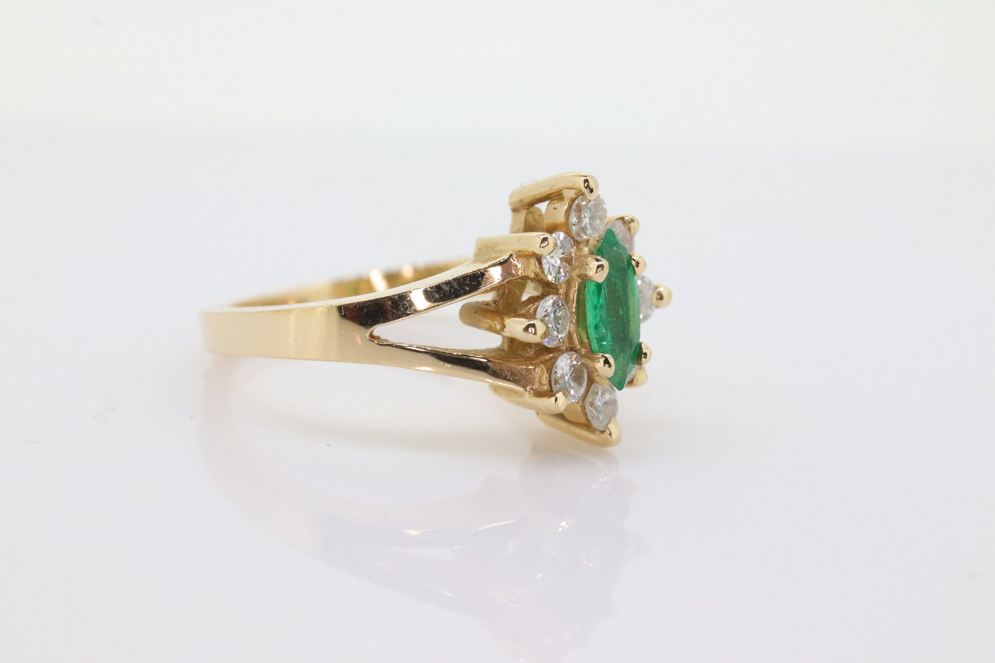 14k Marquise Emerald and Diamond Halo yellow gold ring. 0.36ctw in diamonds