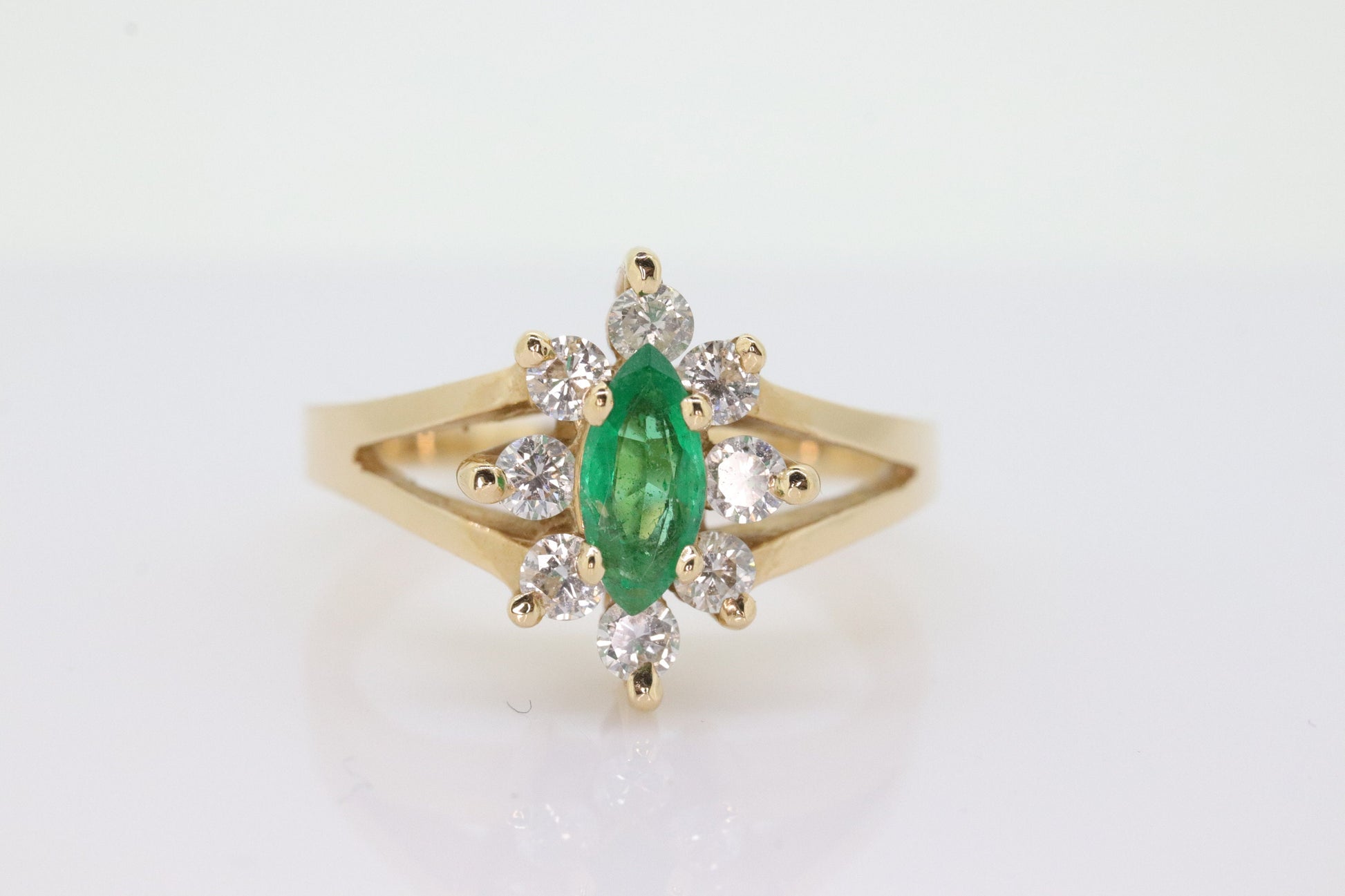 14k Marquise Emerald and Diamond Halo yellow gold ring. 0.36ctw in diamonds