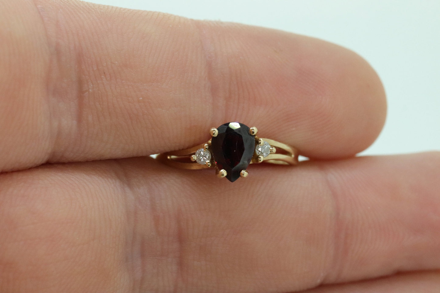 14k Pear Garnet and diamond ring. 14k Pear cut garnet with diamonds solitaire