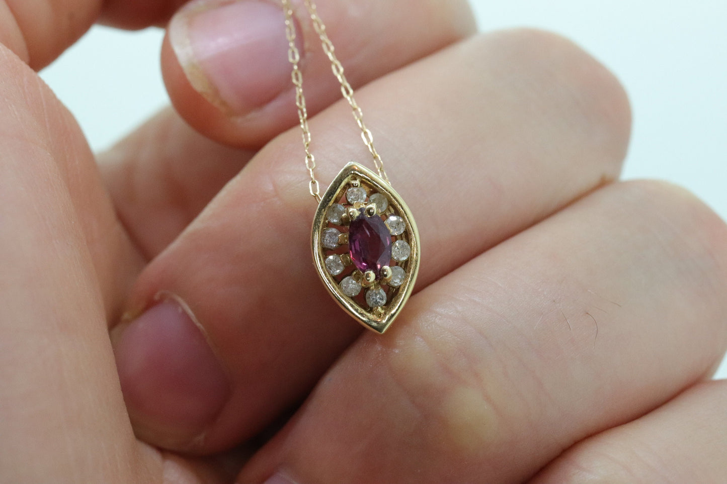 Ruby and diamond halo pendant. 14k precious marquise ruby pendant necklace. st(80/50)