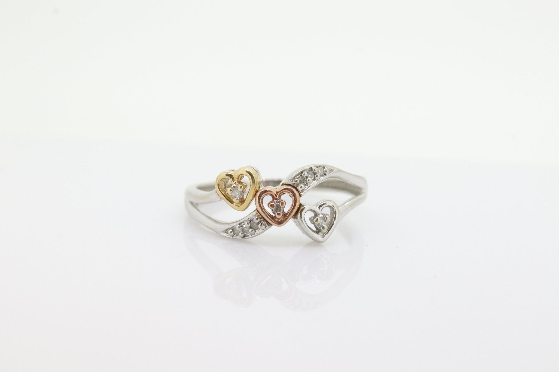 10k Triple Heart Diamond Cluster ring. 10k yellow gold with Rose gold middle heart white gold. st(46)