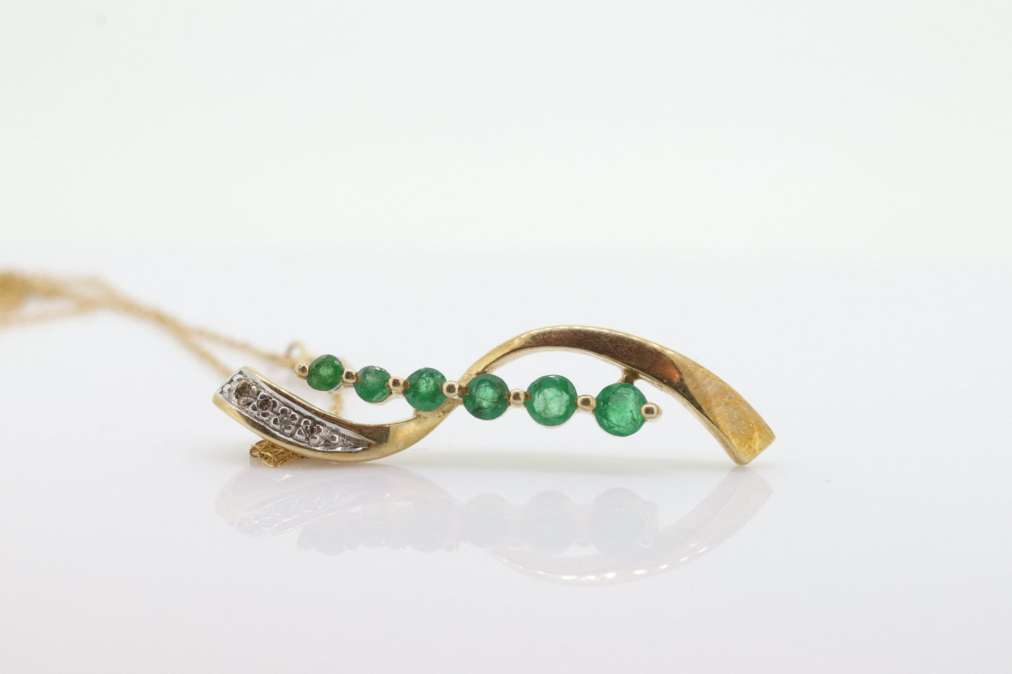 10k Gold 6 emerald Journey Pendant and necklace. Round Green Emerald Graduating Journey Pendant. St(75)