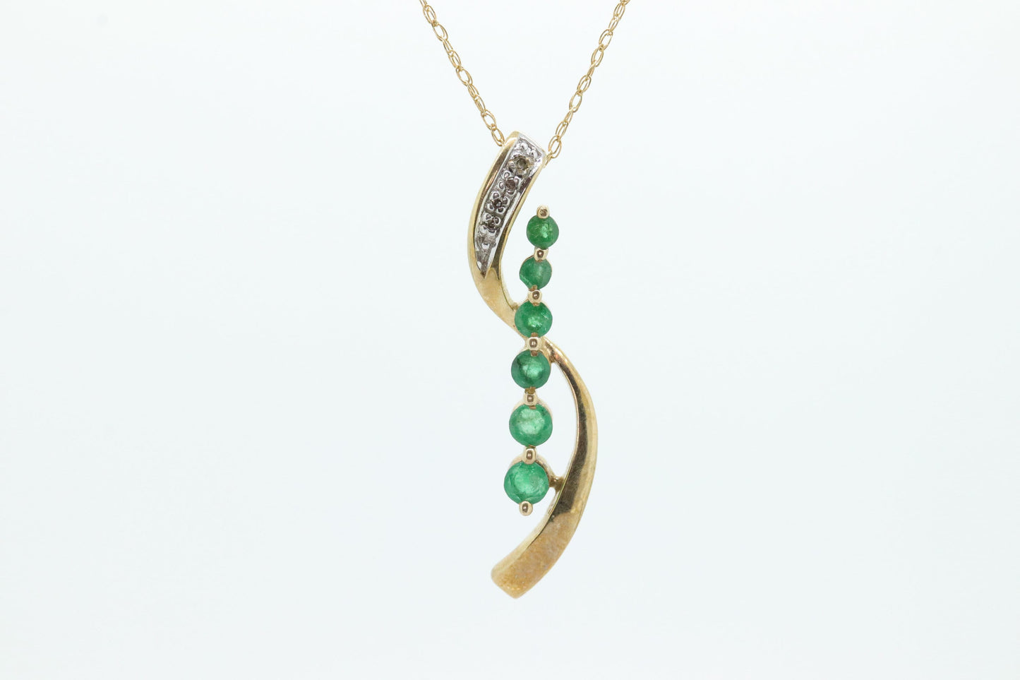 10k Gold 6 emerald Journey Pendant and necklace. Round Green Emerald Graduating Journey Pendant. St(75)