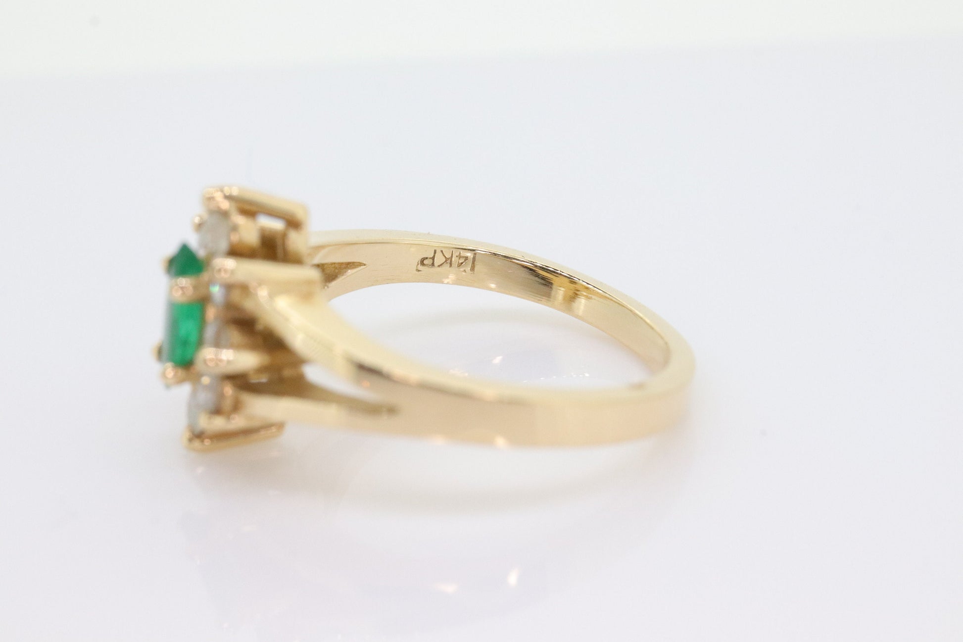 14k Marquise Emerald and Diamond Halo yellow gold ring. 0.36ctw in diamonds