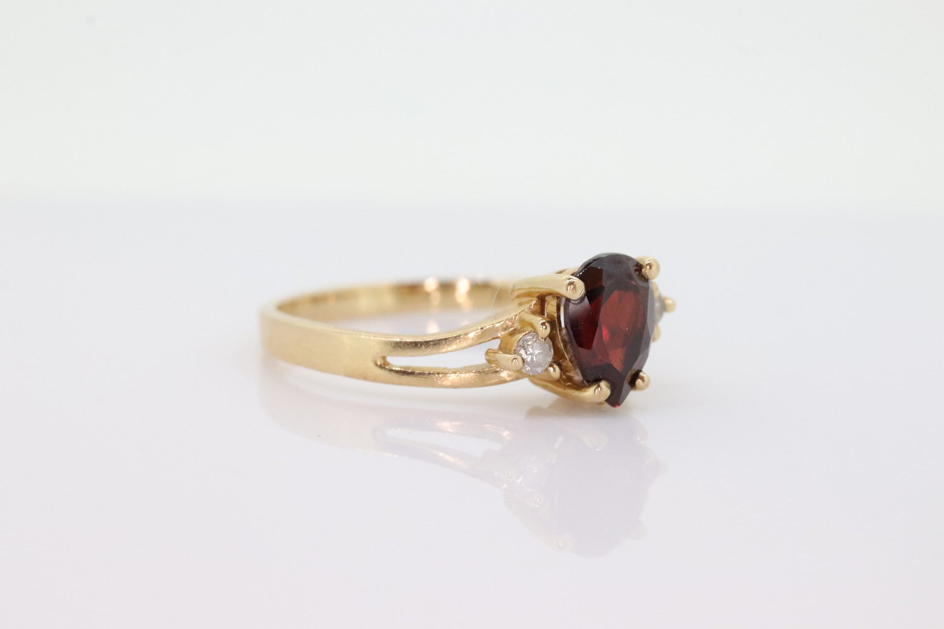 14k Pear Garnet and diamond ring. 14k Pear cut garnet with diamonds solitaire