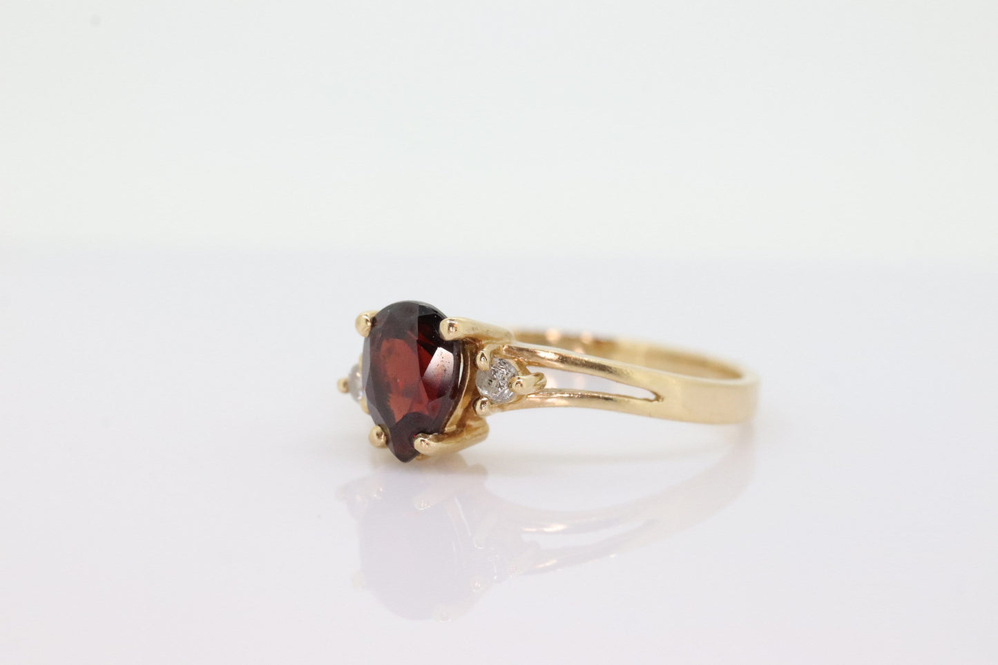 14k Pear Garnet and diamond ring. 14k Pear cut garnet with diamonds solitaire