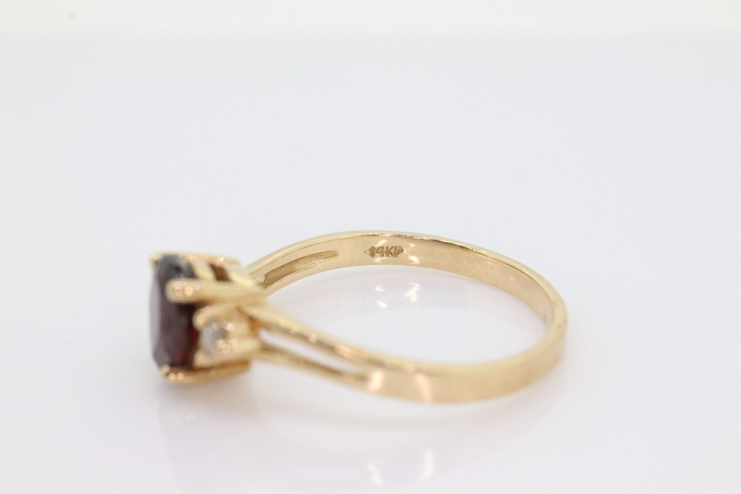 14k Pear Garnet and diamond ring. 14k Pear cut garnet with diamonds solitaire