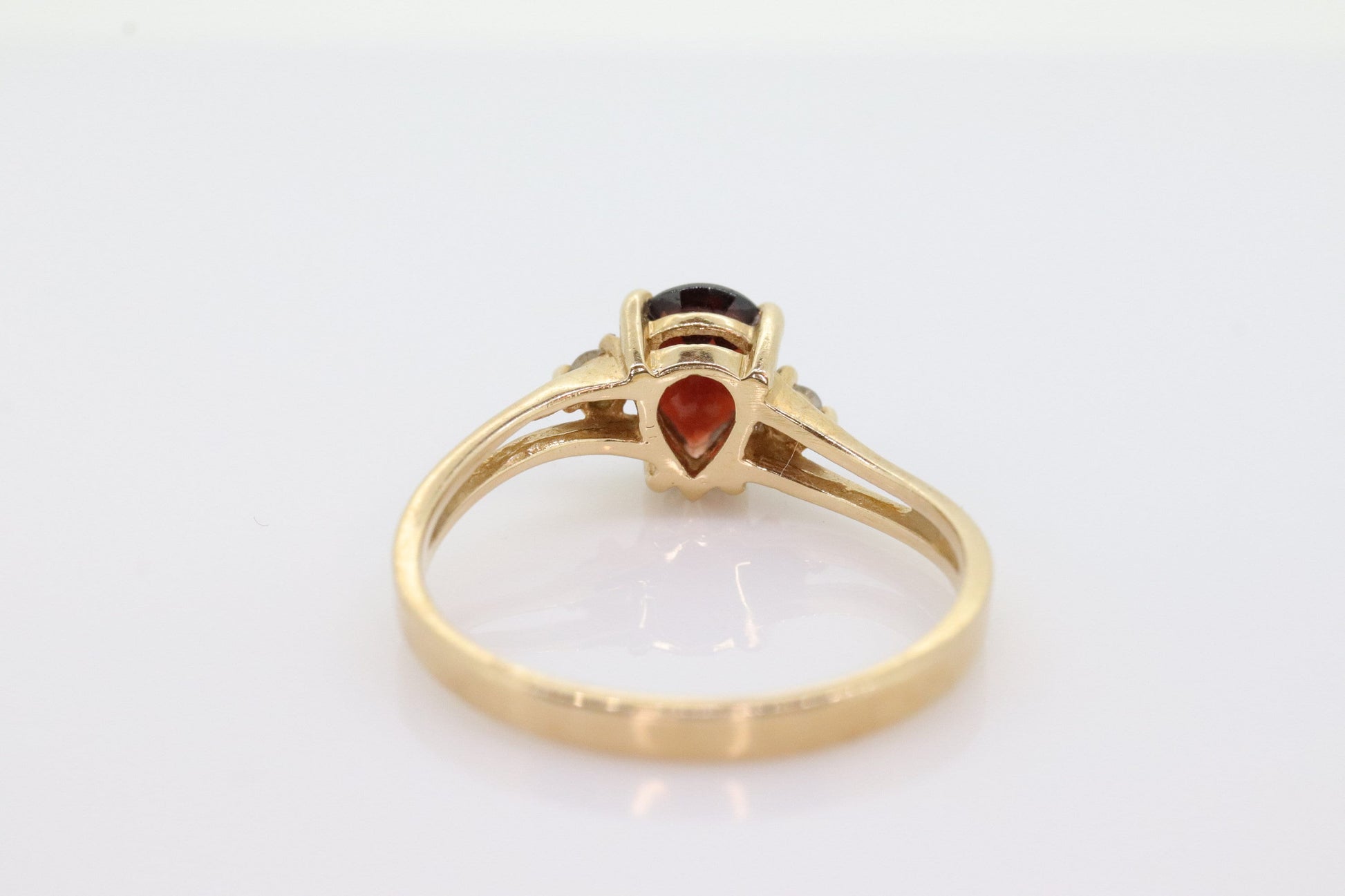 14k Pear Garnet and diamond ring. 14k Pear cut garnet with diamonds solitaire