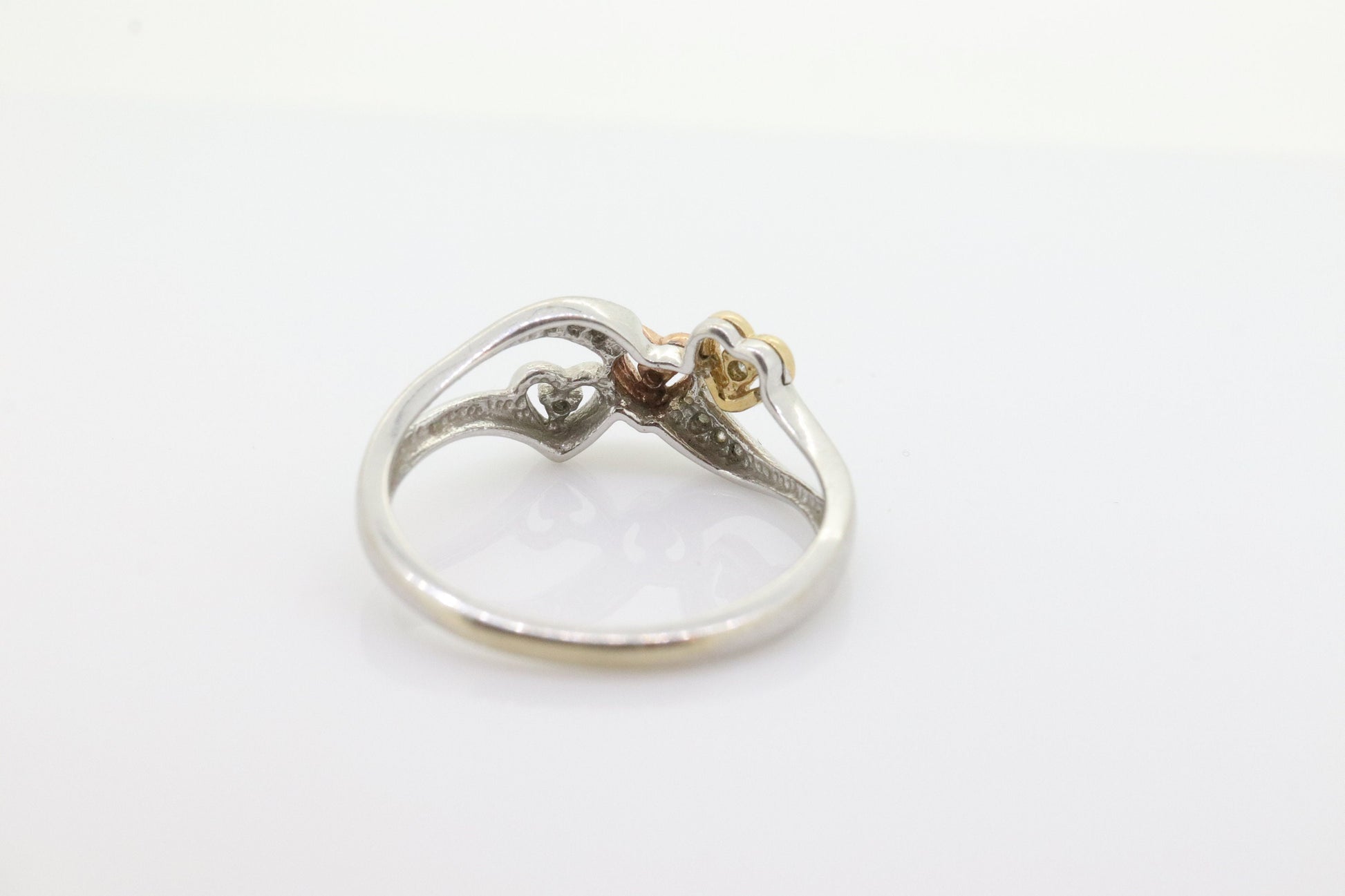 10k Triple Heart Diamond Cluster ring. 10k yellow gold with Rose gold middle heart white gold. st(46)