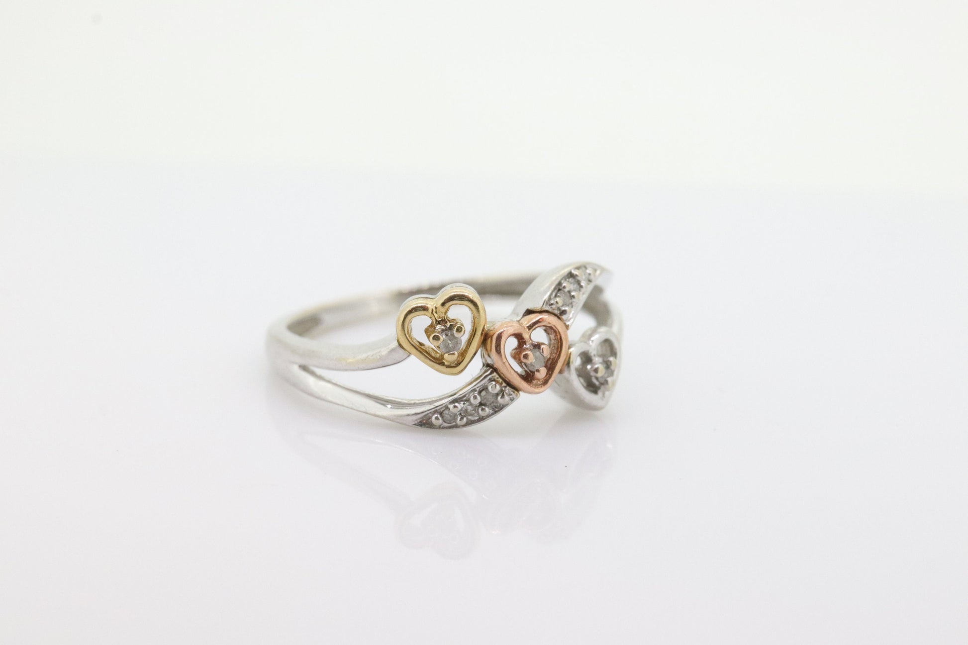 10k Triple Heart Diamond Cluster ring. 10k yellow gold with Rose gold middle heart white gold. st(46)