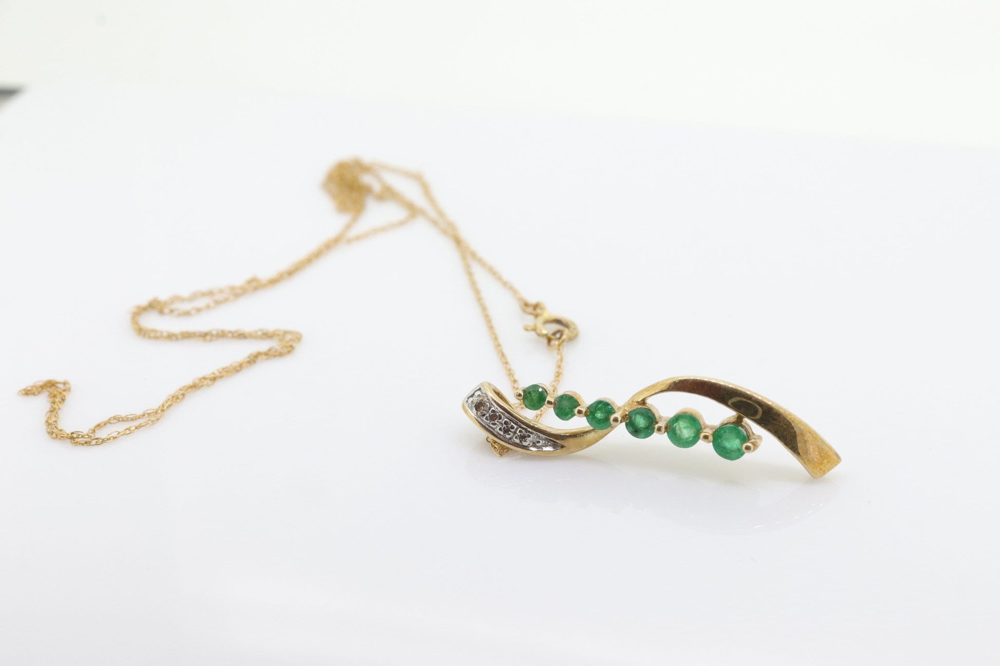 10k Gold 6 emerald Journey Pendant and necklace. Round Green Emerald Graduating Journey Pendant. St(75)