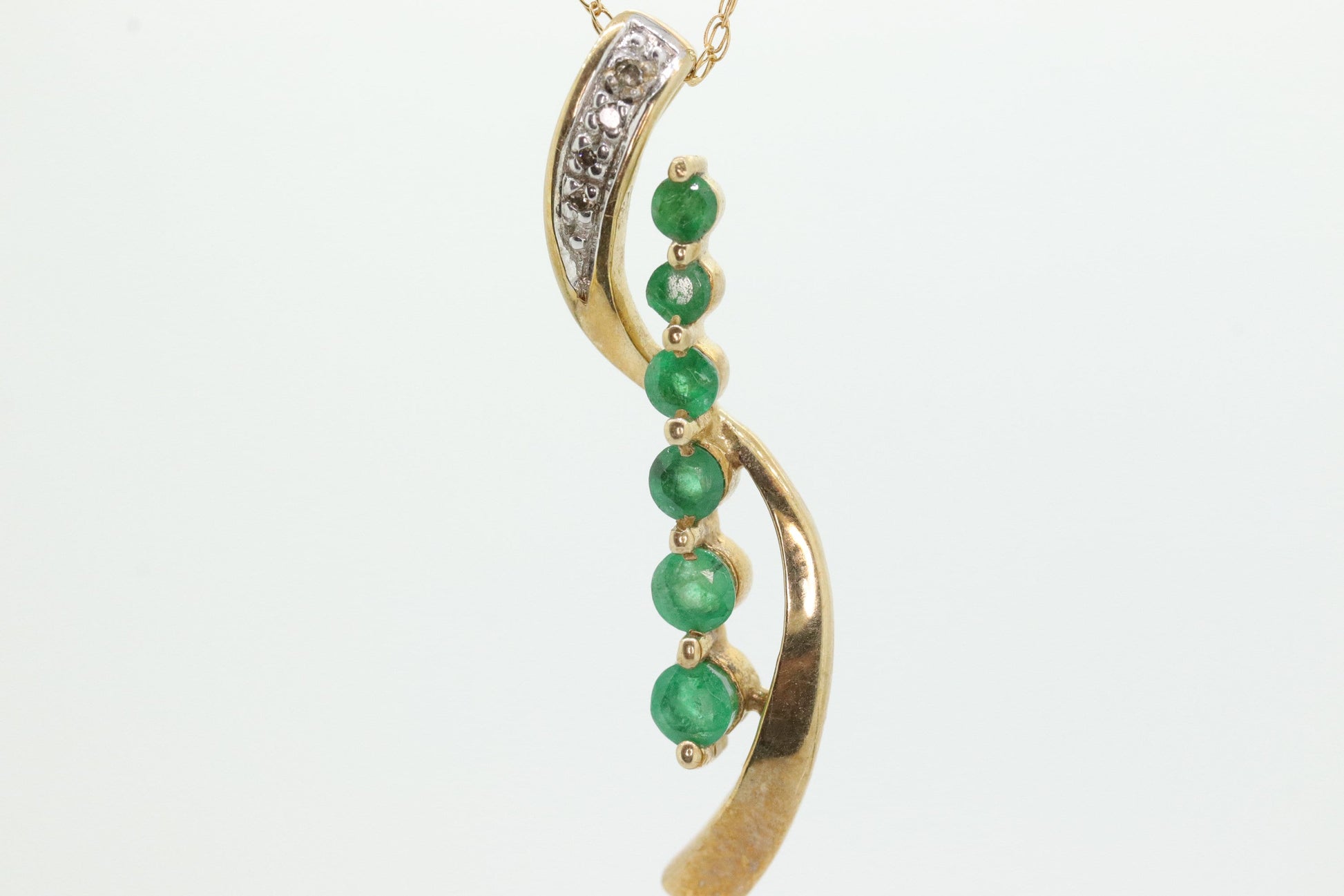 10k Gold 6 emerald Journey Pendant and necklace. Round Green Emerald Graduating Journey Pendant. St(75)