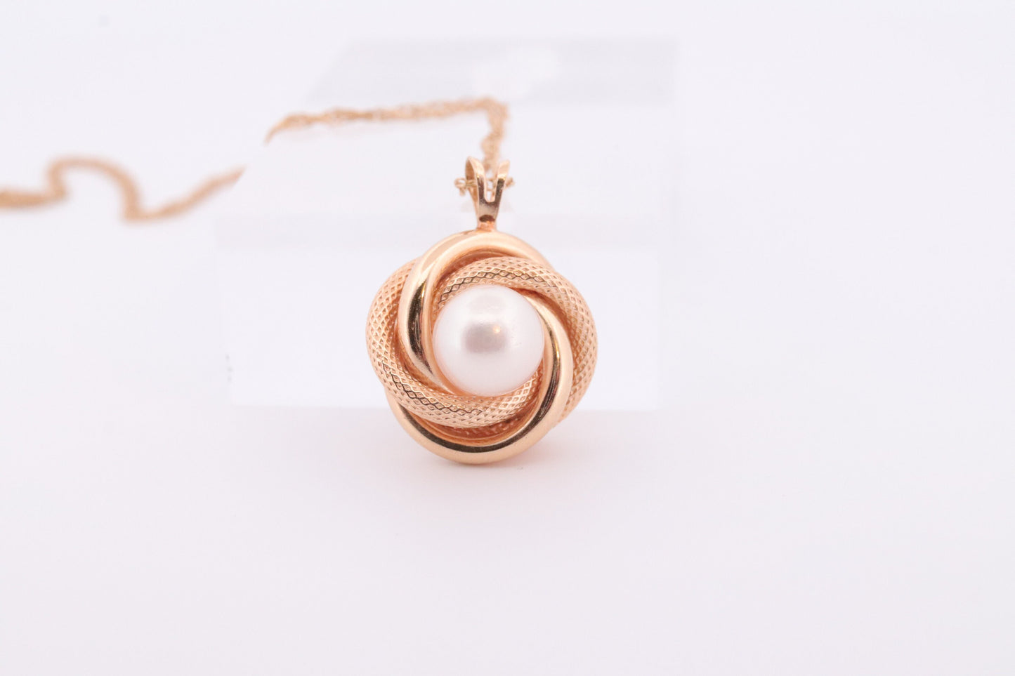 14k Pearl Rope coil Necklace. Pearl Love Knot Pendant Necklace.