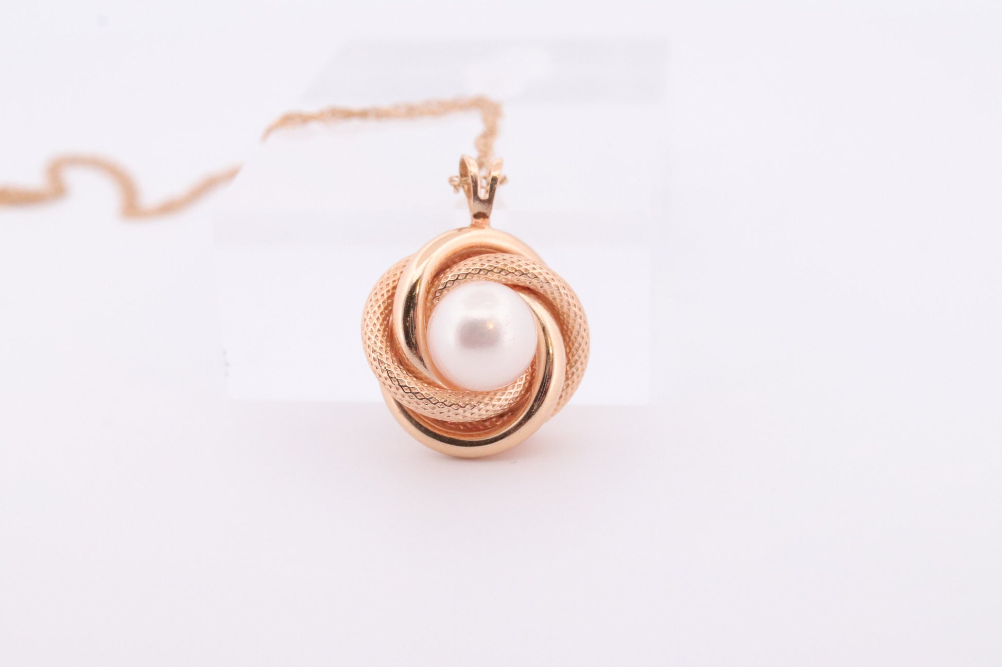 14k Pearl Rope coil Necklace. Pearl Love Knot Pendant Necklace.