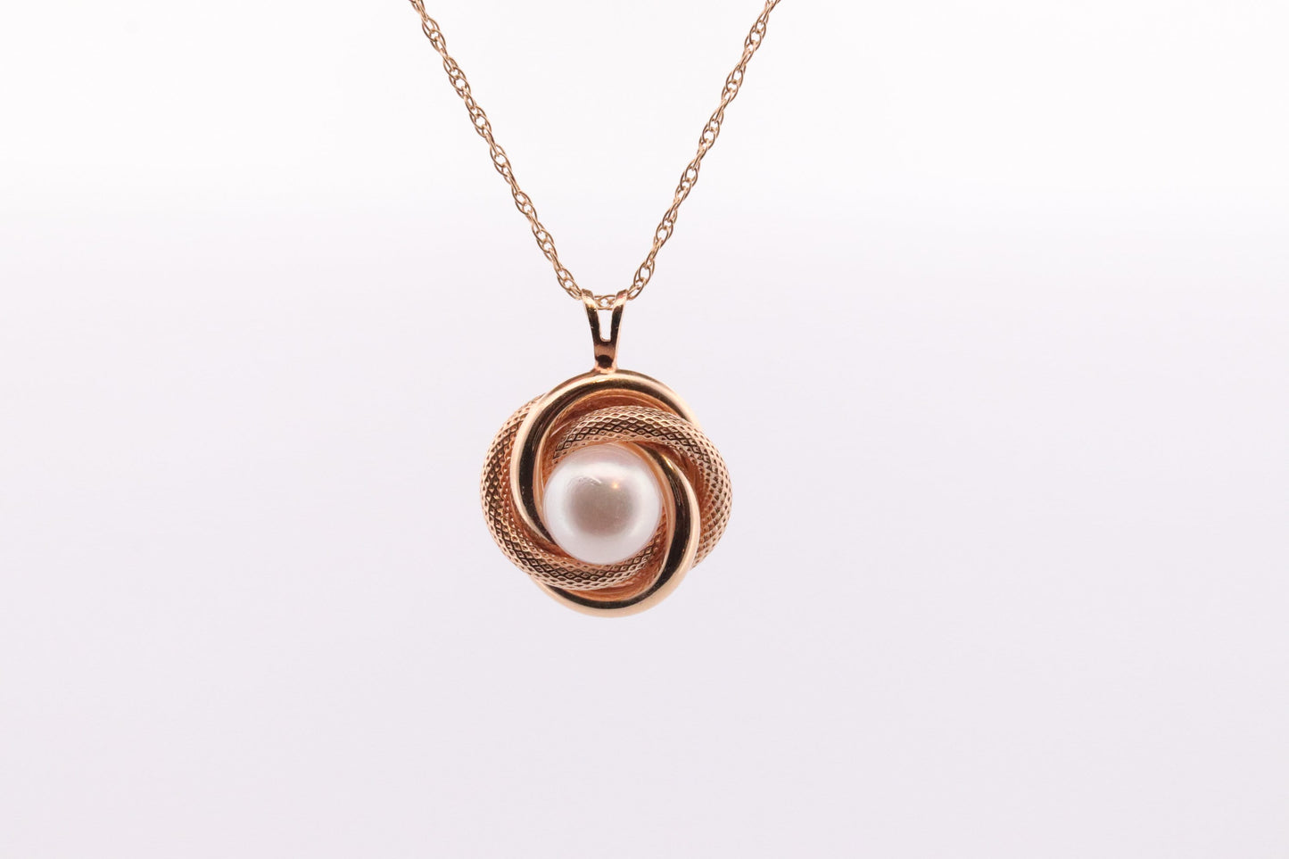 14k Pearl Rope coil Necklace. Pearl Love Knot Pendant Necklace.