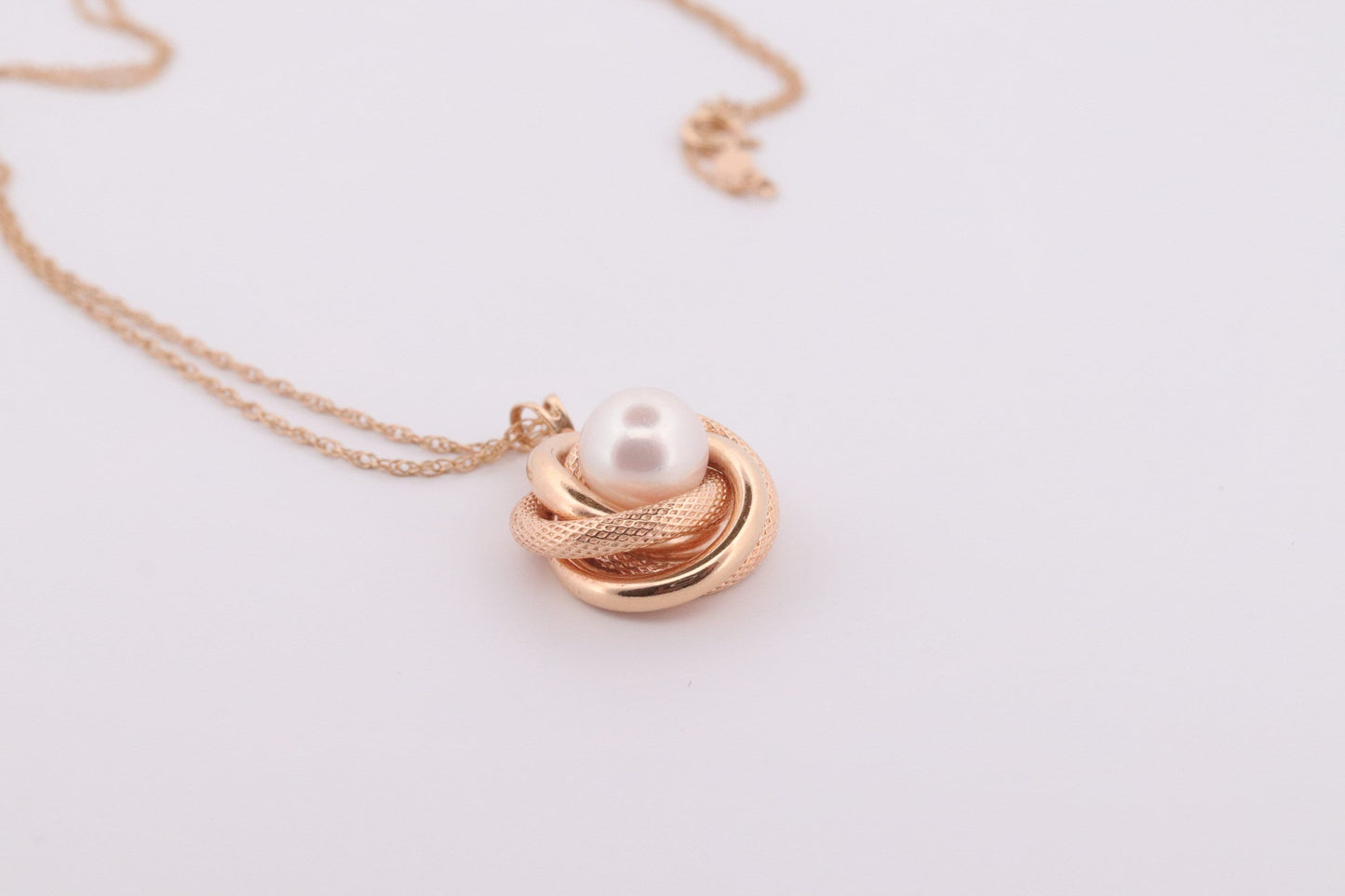 14k Pearl Rope coil Necklace. Pearl Love Knot Pendant Necklace.